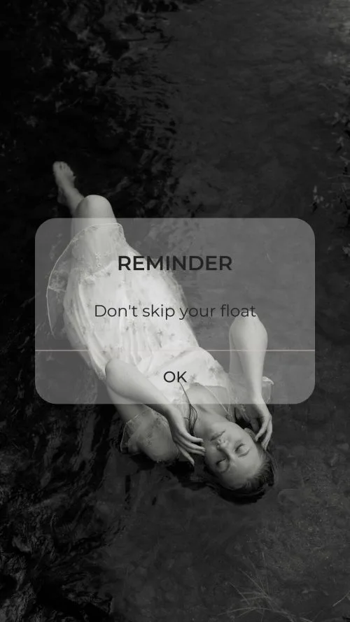 Picture of screensaver with a lady in a white, lacy slip, floating on whatever with a reminder box, that says REMINDER: Don't skip your float.